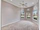 This bedroom is spacious, with large windows that provide plenty of natural light and serene views at 1007 Emerald Dunes Dr, Sun City Center, FL 33573