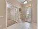 Welcoming foyer with tiled floors, decorative lighting, and easy access to the office and other areas of the home at 1007 Emerald Dunes Dr, Sun City Center, FL 33573