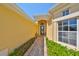 Inviting front entrance featuring a charming walkway and well-maintained landscaping at 1007 Emerald Dunes Dr, Sun City Center, FL 33573