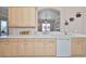 Cozy kitchen with sleek countertops, white cabinetry, and modern appliances offering a functional cooking space at 1007 Emerald Dunes Dr, Sun City Center, FL 33573