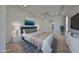 Staged main bedroom featuring a tray ceiling, carpet, and stylish decor at 1007 Emerald Dunes Dr, Sun City Center, FL 33573