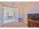 Bright home office with French doors opening to another room at 1007 Emerald Dunes Dr, Sun City Center, FL 33573