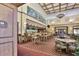 Restaurant bar area featuring stools, tables, and an impressive mural at 1007 Emerald Dunes Dr, Sun City Center, FL 33573
