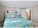 Bedroom with a queen-size bed, ensuite bathroom access, and beachy decor at 4483 Flounder Dr, Hernando Beach, FL 34607