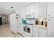 White kitchen with appliances and ample cabinet space at 4483 Flounder Dr, Hernando Beach, FL 34607