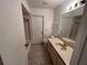 Bathroom with tub, toilet, and vanity at 22491 Delhi Ave, Port Charlotte, FL 33952