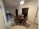Dining room features a wood table and built-in hutch at 22491 Delhi Ave, Port Charlotte, FL 33952