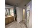 Bathroom with a shower, toilet and vanity with drawers at 22491 Delhi Ave, Port Charlotte, FL 33952
