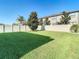 Green grassy backyard, fenced, and sunny at 1953 Nature View Dr, Lutz, FL 33558