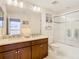 Clean bathroom with double vanity and shower/tub combo at 1953 Nature View Dr, Lutz, FL 33558