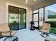 Screened patio with seating area and grill at 1953 Nature View Dr, Lutz, FL 33558