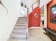 Elegant staircase with a modern design and red accent wall at 1953 Nature View Dr, Lutz, FL 33558