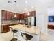 Modern kitchen with granite island and stainless steel appliances at 1953 Nature View Dr, Lutz, FL 33558
