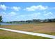 Community lakefront view with homes in the background at 1953 Nature View Dr, Lutz, FL 33558