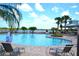 Resort-style pool with lounge chairs and lake view at 1953 Nature View Dr, Lutz, FL 33558