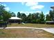 Dog park with agility equipment and shaded seating at 1953 Nature View Dr, Lutz, FL 33558