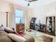 Comfortable living room featuring a brown couch and built-in shelving at 1953 Nature View Dr, Lutz, FL 33558