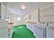 Laundry room with washer, dryer and cabinets at 218 Glenellen Pl, Sun City Center, FL 33573