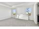 Spacious bedroom with grey carpet and large windows at 1526 5Th S St, St Petersburg, FL 33701