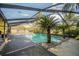 Inviting screened pool area with lush landscaping at 4805 Bugg Rd, Plant City, FL 33567