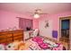 Pink bedroom with a bed, desk and closet at 4805 Bugg Rd, Plant City, FL 33567