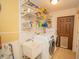 Laundry room with washer, dryer, and utility sink at 4805 Bugg Rd, Plant City, FL 33567