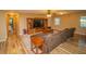 Gathering room with large sectional sofa and wood floors at 4805 Bugg Rd, Plant City, FL 33567