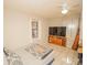 Bedroom with a bed, TV, and dresser at 4805 Bugg Rd, Plant City, FL 33567