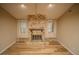 Living room with stone fireplace and hardwood floors at 4805 Bugg Rd, Plant City, FL 33567