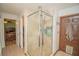 Bathroom with shower stall, double sinks, and updated vanity at 4805 Bugg Rd, Plant City, FL 33567