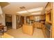 Spacious kitchen with island, granite countertops, and wood cabinets at 4805 Bugg Rd, Plant City, FL 33567