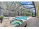 Relaxing pool and spa area with screened enclosure at 6619 Current Dr, Apollo Beach, FL 33572