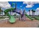 Modern playground with slides, climbing structures, and play areas at 6619 Current Dr, Apollo Beach, FL 33572