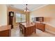 Formal dining room with wood table and built-in hutch at 6619 Current Dr, Apollo Beach, FL 33572