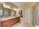 Bathroom boasts double sinks, granite countertop, and a walk-in shower at 6619 Current Dr, Apollo Beach, FL 33572