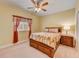 Cozy bedroom with a queen-size bed and built-in storage drawers at 6619 Current Dr, Apollo Beach, FL 33572
