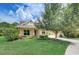 House exterior featuring yellow walls, landscaping and driveway at 6619 Current Dr, Apollo Beach, FL 33572