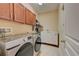 Laundry room with washer, dryer, and upper cabinets at 6619 Current Dr, Apollo Beach, FL 33572
