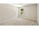 Comfortable carpeted bedroom with bright natural light and neutral colors at 7201 S De Soto St, Tampa, FL 33616
