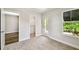 This bedroom boasts plush carpeting, balcony access, and a convenient walk-in closet for ample storage at 7201 S De Soto St, Tampa, FL 33616