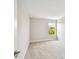 Cozy bedroom featuring neutral walls, plush carpeting, and a bright window at 7201 S De Soto St, Tampa, FL 33616