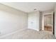 Bedroom with carpeted floor, bright natural light and closet at 7201 S De Soto St, Tampa, FL 33616