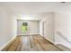 Bedroom with hardwood floor, bright natural light, white trim and neutral walls at 7201 S De Soto St, Tampa, FL 33616