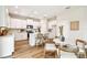 Modern kitchen with white cabinetry, stainless steel appliances, an island, and barstool seating at 7201 S De Soto St, Tampa, FL 33616