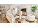 Comfortable living room with cozy chairs, a wooden table, and natural light, offering a relaxed and inviting atmosphere at 7201 S De Soto St, Tampa, FL 33616