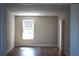 Bright bedroom featuring wood floors and a window at 7205 S De Soto St, Tampa, FL 33616