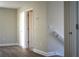 Upstairs bedroom with wood-look flooring and freshly painted walls at 7205 S De Soto St, Tampa, FL 33616
