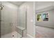 Shower with glass enclosure and built-in seat at 837 Snail Kite Pl, Sun City Center, FL 33573