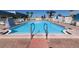 Community pool with plenty of lounge chairs at 116 W Saint Johns Way, Apollo Beach, FL 33572