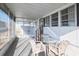 Spacious screened porch with table and chairs, perfect for relaxing at 116 W Saint Johns Way, Apollo Beach, FL 33572